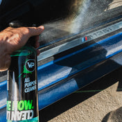 vp detailing all purpose cleaner being sprayed onto dirty door sill of a bmw m135i