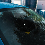 Ceramic washer fluid / screen wash beading with water running off the wind screen
