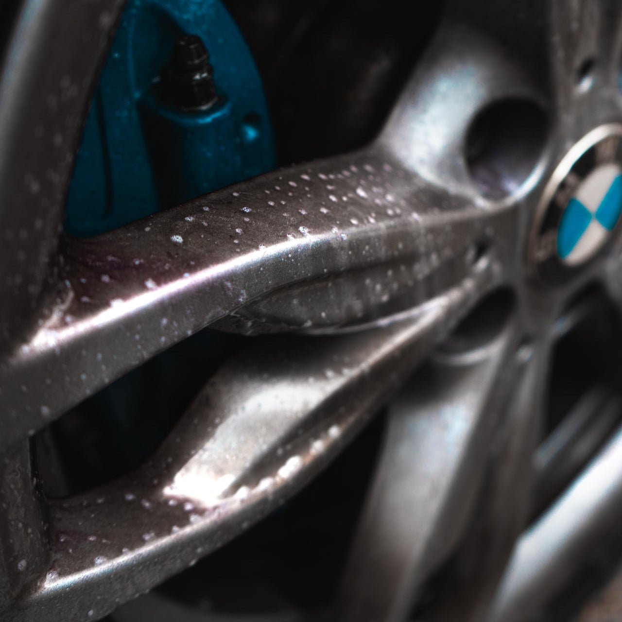 close up of bmw m135i alloy wheel being cleaned and detailed