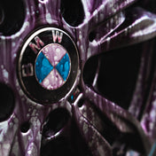 close up of bmw m135i wheel with iron fallout remover all over it reacting with brake dust and iron bleeding purple