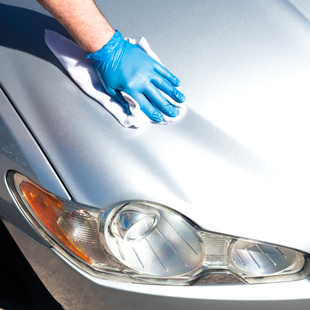 jaguar being detailed and cleaned with white micro fibre and quick detailer