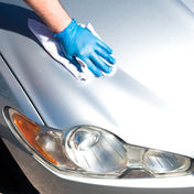 jaguar being detailed and cleaned with white micro fibre and quick detailer