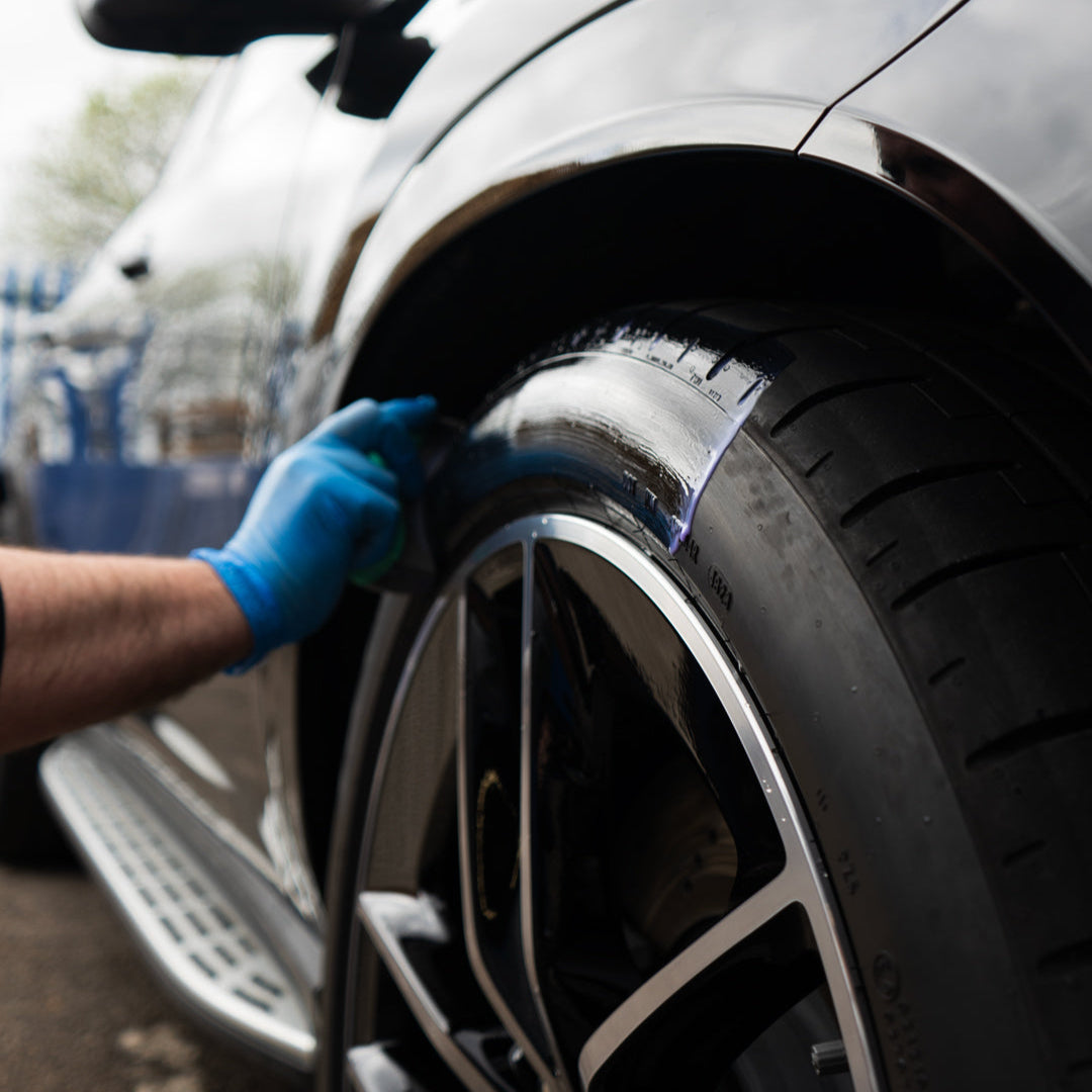 satin tyre shine being applied to car tyre
