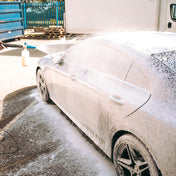 mercedes amg being covered in snow foam