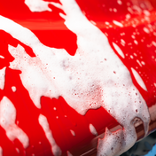 suds running of red car