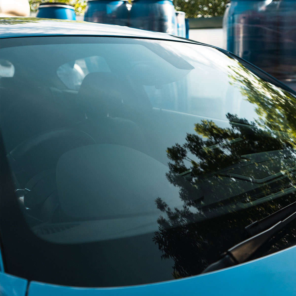 super clean front car wind screen with reflections in the glass