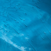 close up of water beading on blue car