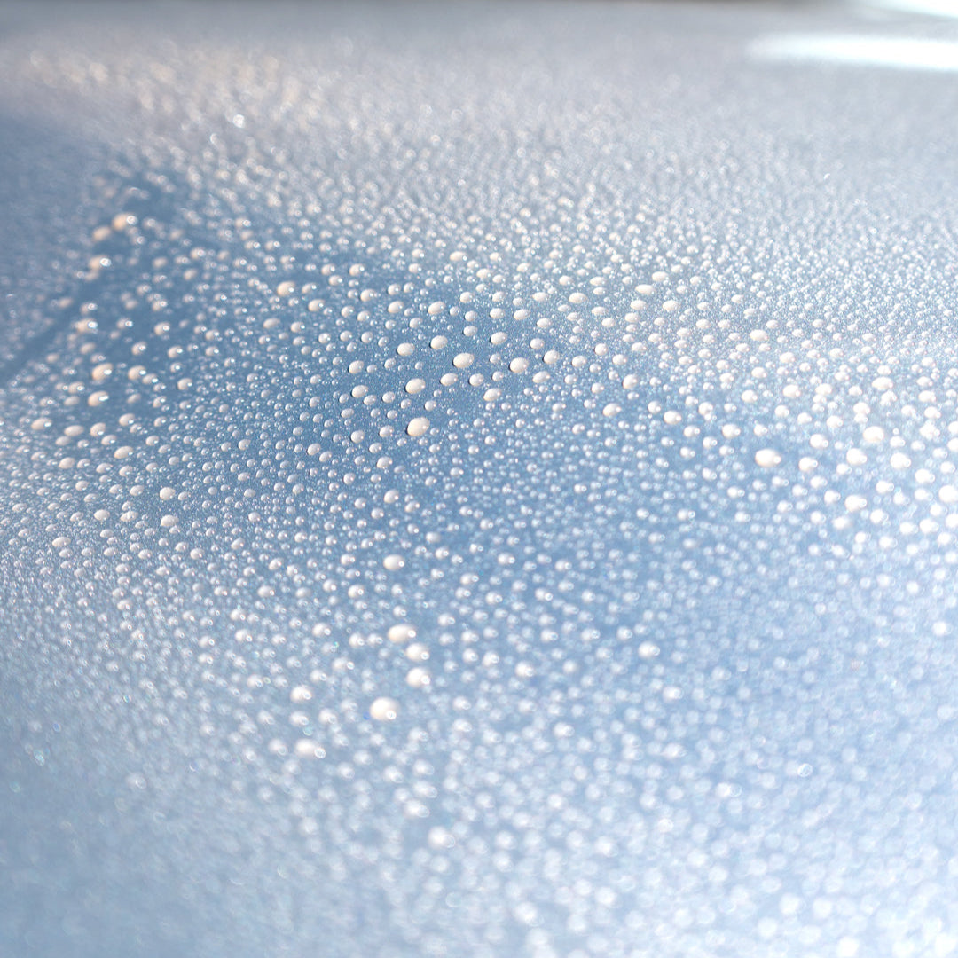 silver car with beading quick detailer on paintwork