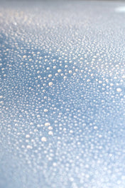 silver car with beading quick detailer on paintwork