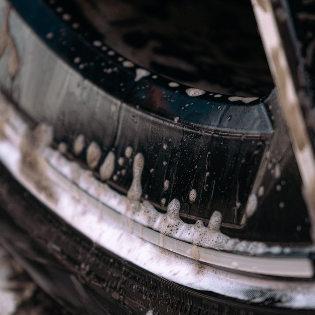 close up of dirt being cleaned away off alloy wheel