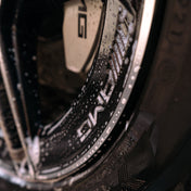 close up of mercedes alloy wheel with amg badging