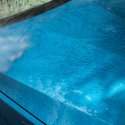 jet wash water creating beading on blue car 